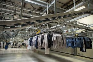 Aramark Laundry building interior clothes on rack