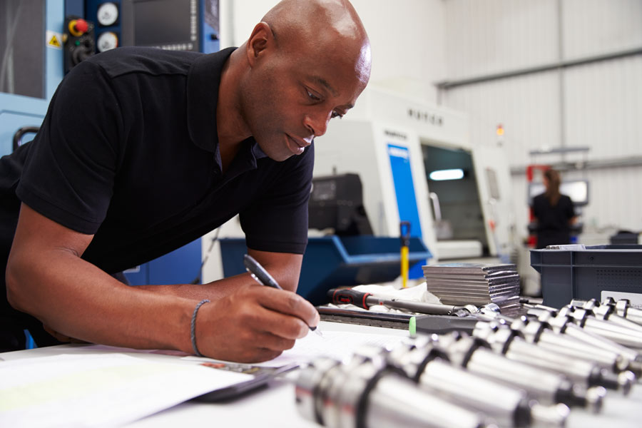 Man making notes on construction plans